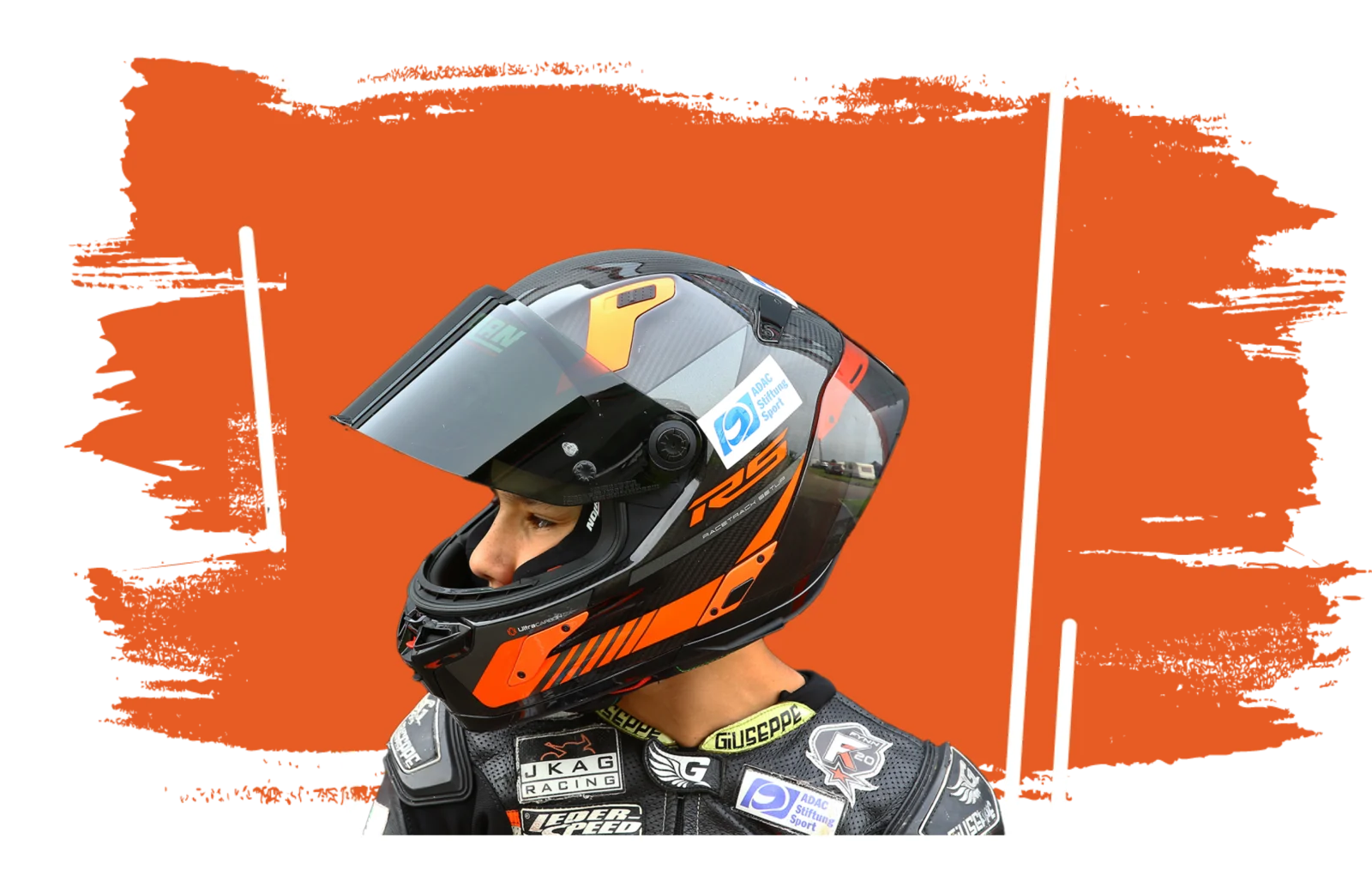 Fynn Kratochwil in racing gear and helmet